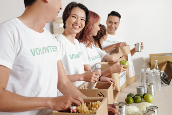 Students volunteering in branded group apparel at a charitable foundation