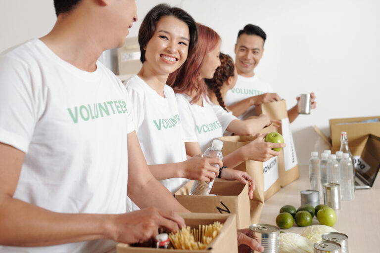 Students volunteering in branded group apparel at a charitable foundation